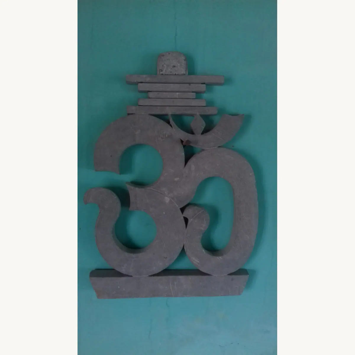 OM stone decor with a carved base