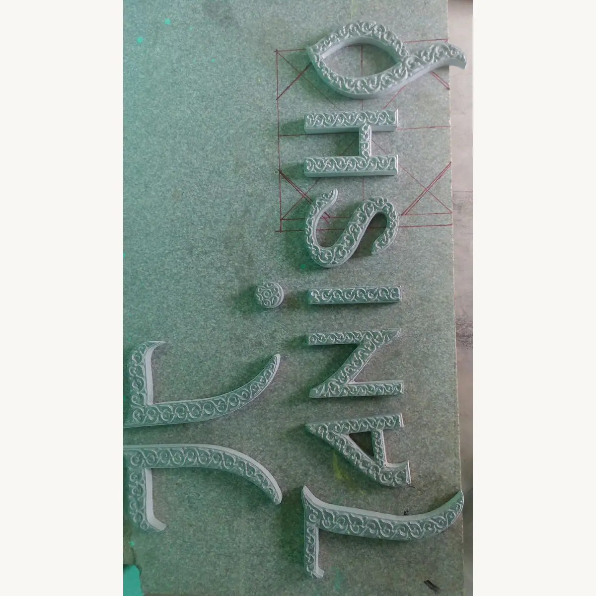 Close-up of decorative lettering carved in stone
