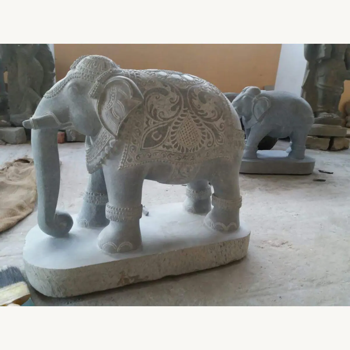 Side profile of a custom elephant stone statue