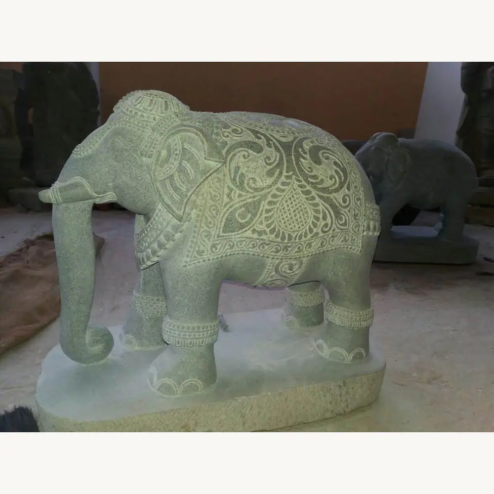 Custom elephant stone statue shown from a workshop angle