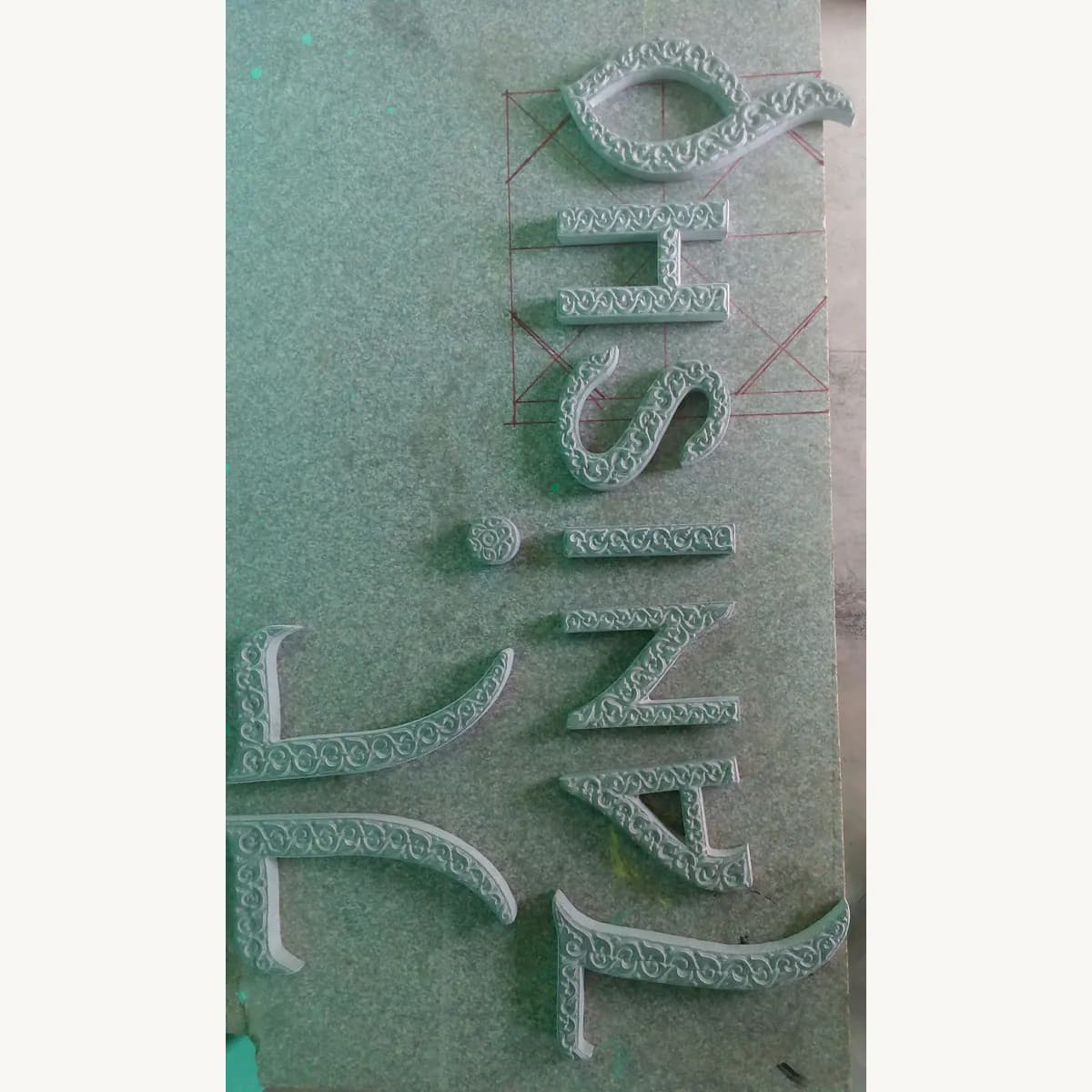 Close-up of engraved office nameplate lettering