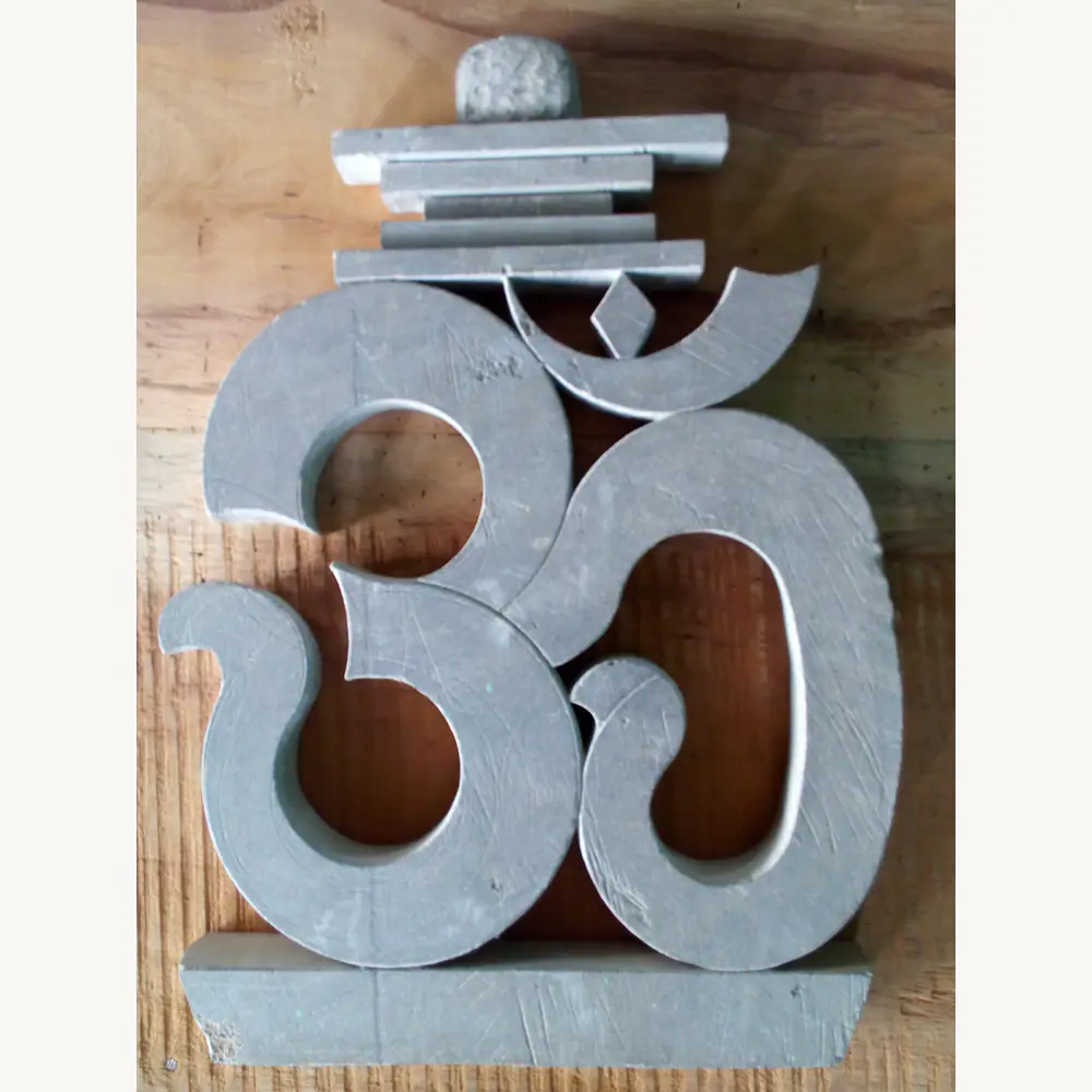 Om stone decor detail for puja spaces